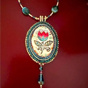 Hand beaded by me porcelain pendant with beaded drop.